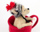 Side view of Monette the Chihuahua in a cup, needle felted composition