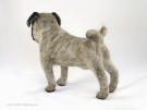 Needlefelt pug, facing left, side view